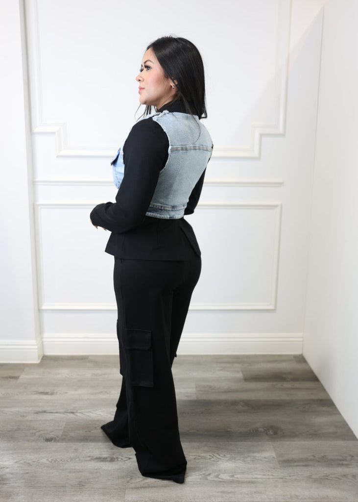 Person lying on a white floor with a wooden wall background