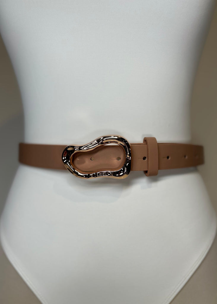 Brown belt with a decorative buckle on a mannequin.