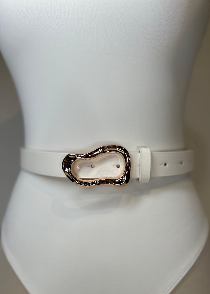 White belt with a decorative buckle on a mannequin.